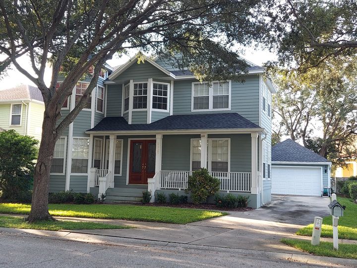 A two-story home with a finished roof